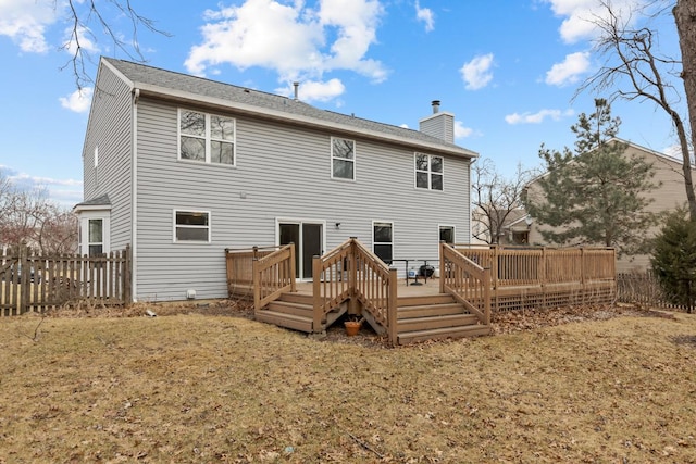 back of house with a yard and a deck