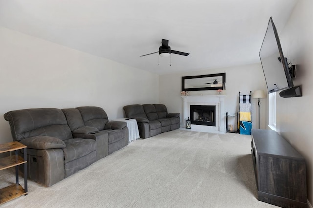 carpeted living room featuring ceiling fan