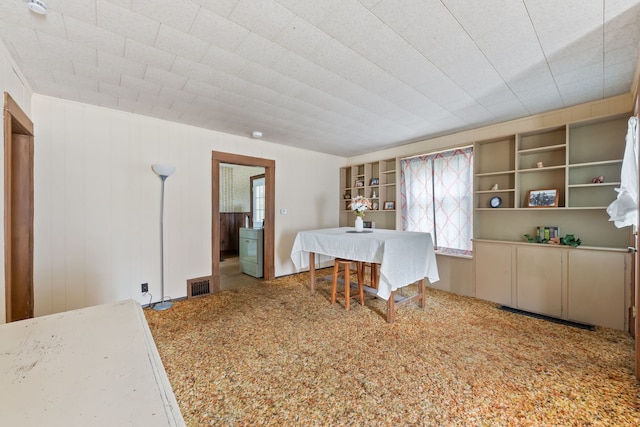 dining room featuring carpet flooring and washer / clothes dryer