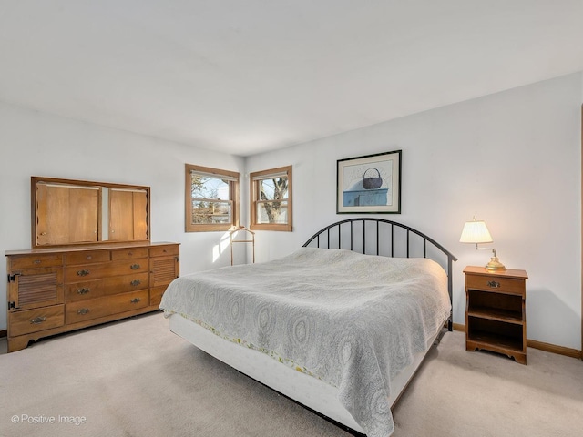 bedroom featuring light colored carpet