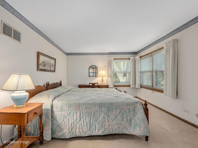 bedroom featuring crown molding and carpet flooring