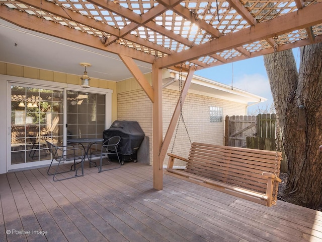 wooden terrace featuring grilling area and a pergola