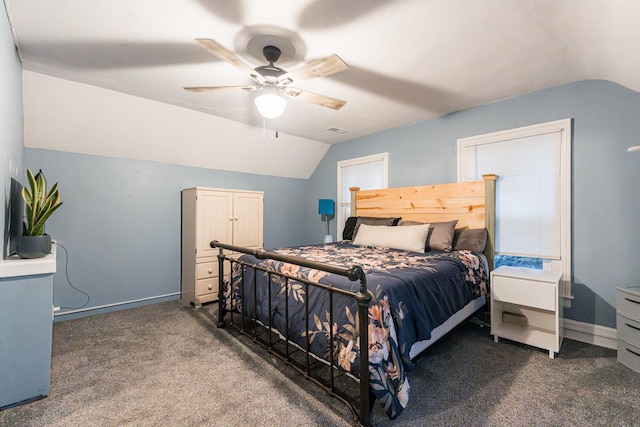 bedroom featuring dark carpet, ceiling fan, and vaulted ceiling