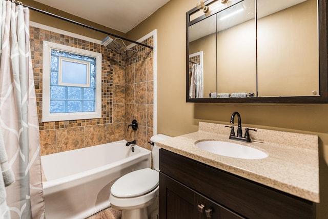 full bathroom featuring shower / tub combo with curtain, vanity, and toilet