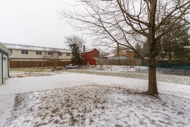 view of yard covered in snow