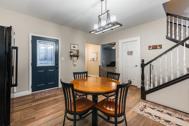 dining area featuring dark hardwood / wood-style floors and ceiling fan