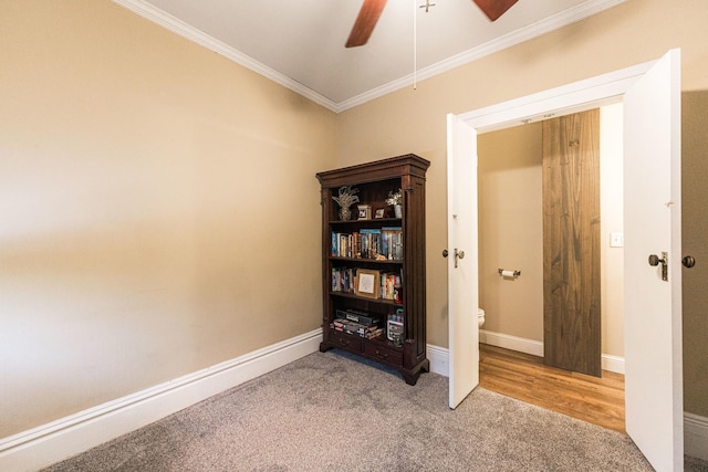 spare room featuring ceiling fan, ornamental molding, and carpet floors