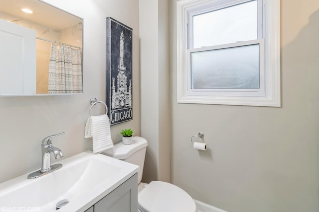 bathroom with vanity and toilet