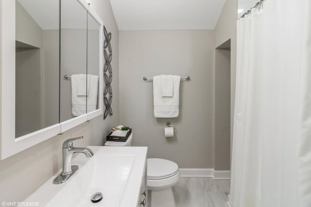 bathroom featuring sink and toilet