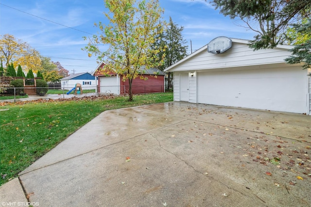 garage featuring a yard