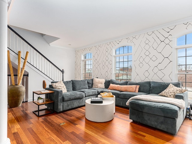 living room featuring ornamental molding, hardwood / wood-style floors, and a wealth of natural light