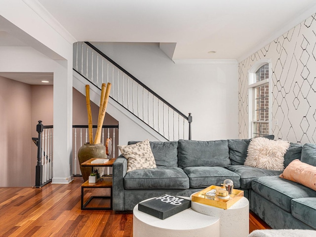 living room with dark hardwood / wood-style flooring and ornamental molding