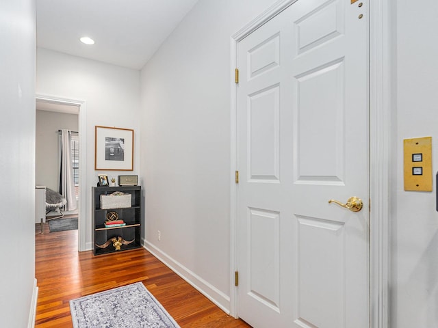 hall with wood-type flooring