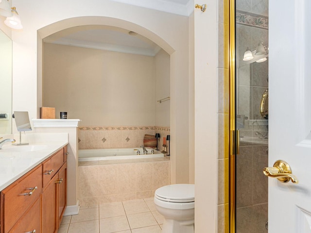 full bathroom with vanity, ornamental molding, tile patterned floors, shower with separate bathtub, and toilet