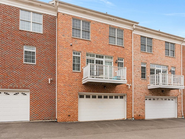 back of property with a garage