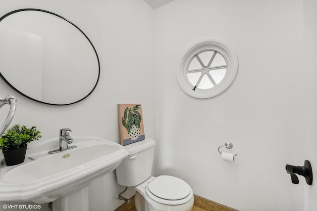 bathroom with sink and toilet