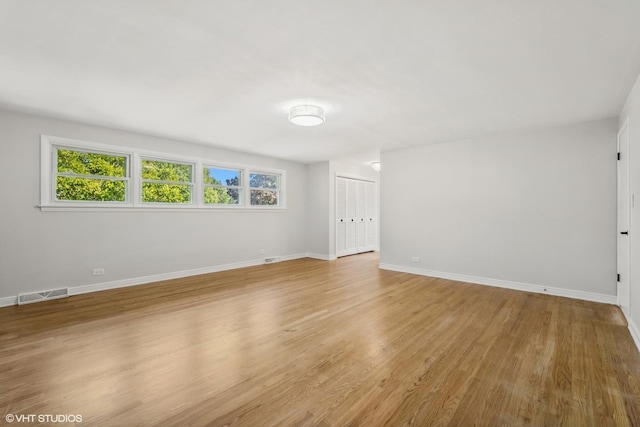 spare room with light wood-type flooring