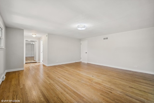 spare room featuring light wood-type flooring