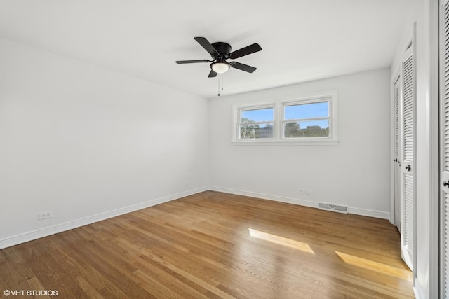 unfurnished bedroom with ceiling fan and light hardwood / wood-style flooring