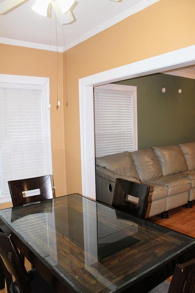 dining area featuring crown molding