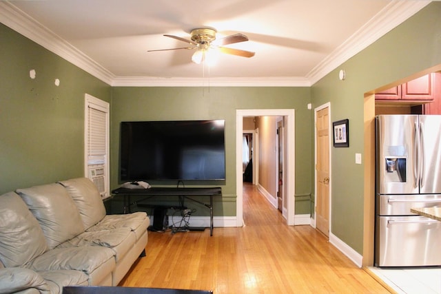 living room featuring crown molding, ceiling fan, and light hardwood / wood-style flooring