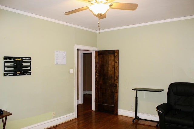 sitting room featuring crown molding, ceiling fan, and dark hardwood / wood-style flooring