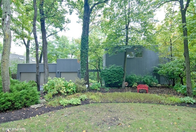 view of yard featuring a garage