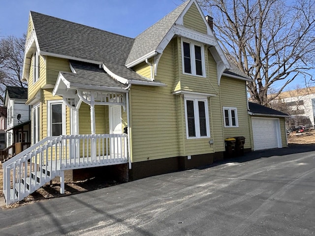 view of front of house featuring a garage and covered porch