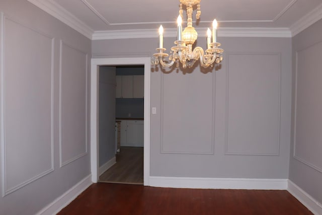 interior space with an inviting chandelier, crown molding, and dark hardwood / wood-style floors