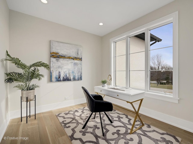 home office featuring wood finished floors, baseboards, and recessed lighting
