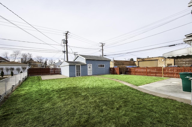 view of yard featuring a patio and an outdoor structure