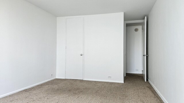 4800 S Chicago Beach Dr Unit 1404S, Chicago, IL 60615 - unfurnished bedroom with carpet, baseboards, and a closet