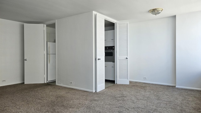 4800 S Chicago Beach Dr Unit 1404S, Chicago, IL 60615 - unfurnished bedroom featuring freestanding refrigerator, carpet floors, and baseboards