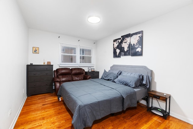 bedroom featuring wood-type flooring