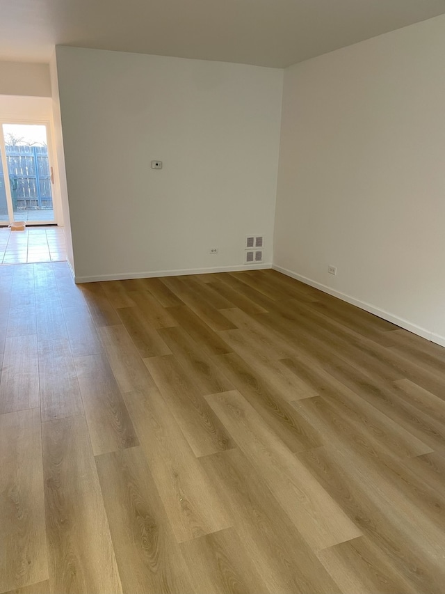 empty room with wood-type flooring