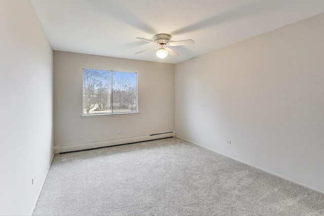 carpeted spare room featuring ceiling fan and baseboard heating