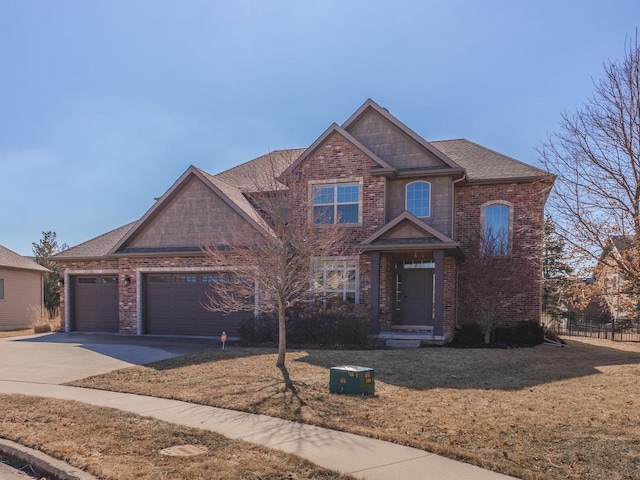 view of front facade with a garage, concrete driveway, fence, a front lawn, and brick siding