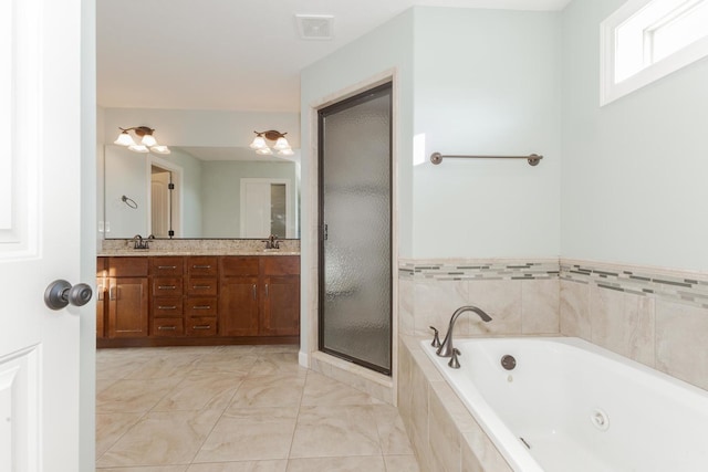 full bath with a whirlpool tub, double vanity, a stall shower, and a sink