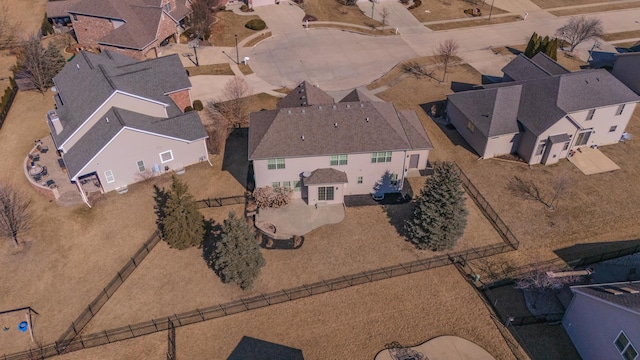 birds eye view of property with a residential view