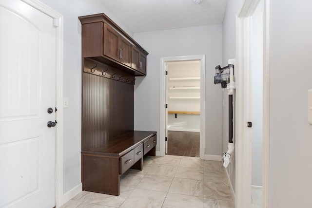 mudroom featuring baseboards