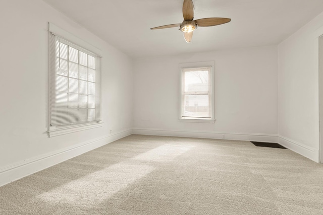 unfurnished room with light carpet and ceiling fan