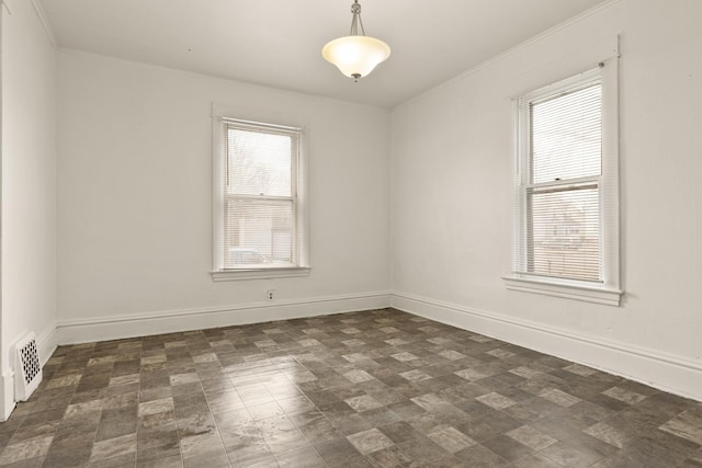 spare room with ornamental molding