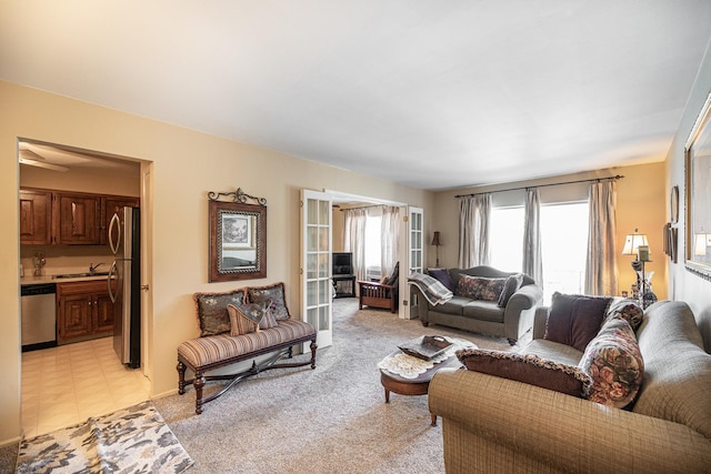 carpeted living room featuring sink