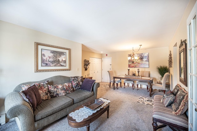 living room with a notable chandelier and carpet flooring