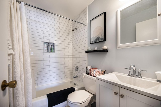 full bathroom featuring shower / bath combo, vanity, and toilet