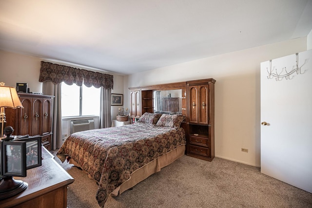 carpeted bedroom with an AC wall unit