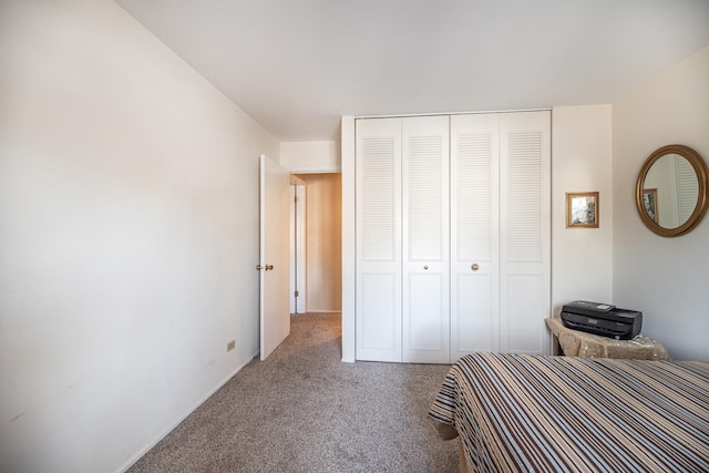 unfurnished bedroom featuring carpet flooring and a closet