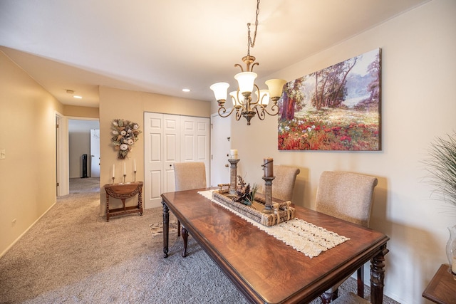 carpeted dining space featuring an inviting chandelier