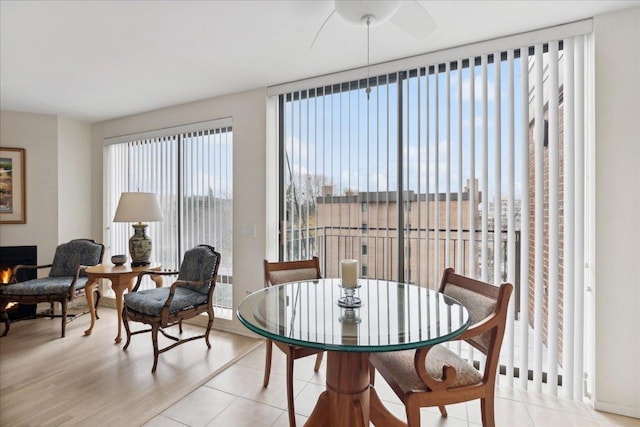 dining area with expansive windows and light tile patterned floors