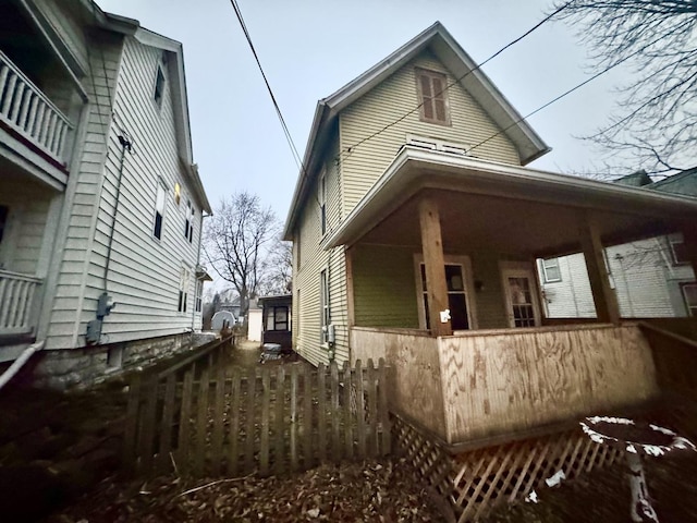 view of property exterior with a porch